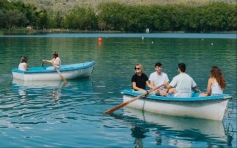 Row in a rowboat around the lake